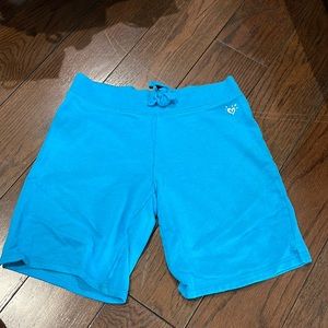 Justice kids bright blue shorts. Size 14.